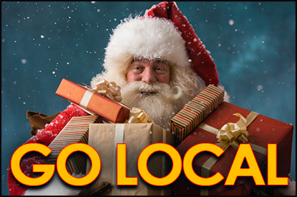 Santa holding a load of wrapped presents supporting the Go Local Movement